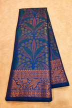 Blue fabric with intricate floral patterns on a beige background