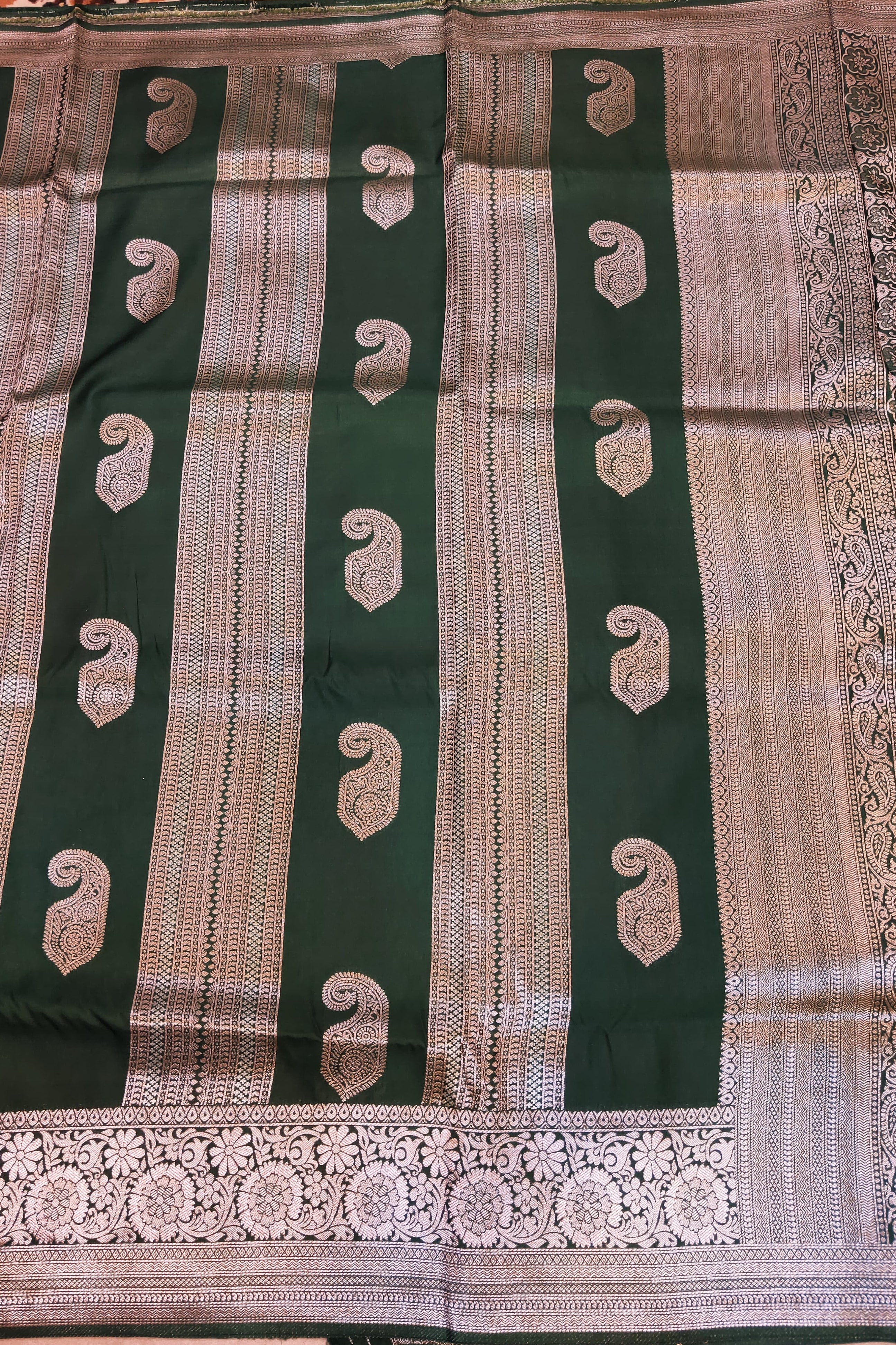 Green and brown saree with intricate patterns