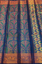 Traditional patterned fabric with intricate designs on a yellow background
