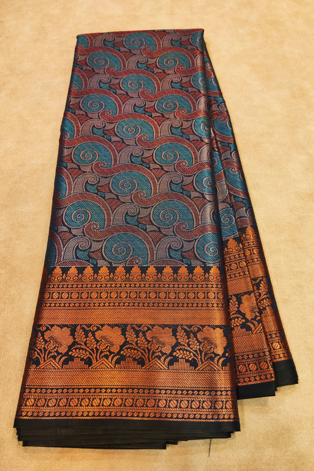 Traditional patterned fabric on a beige background