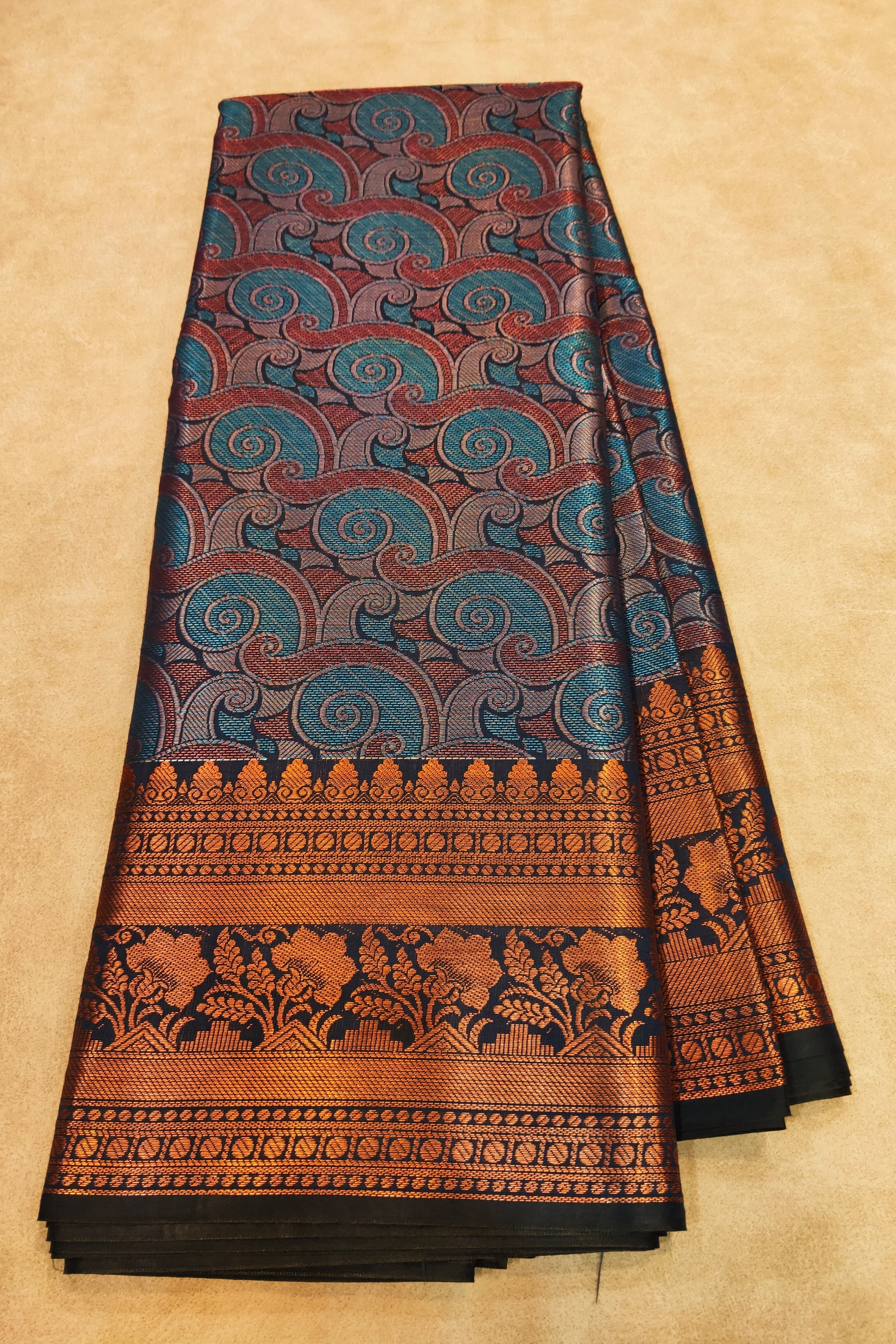 Traditional patterned fabric on a beige background