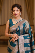 Woman wearing a traditional saree with a blurred background