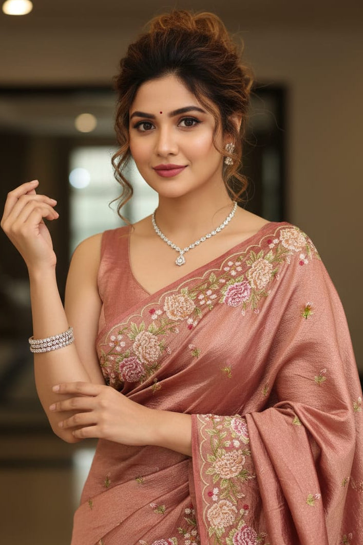 woman wearing a floral saree indoors