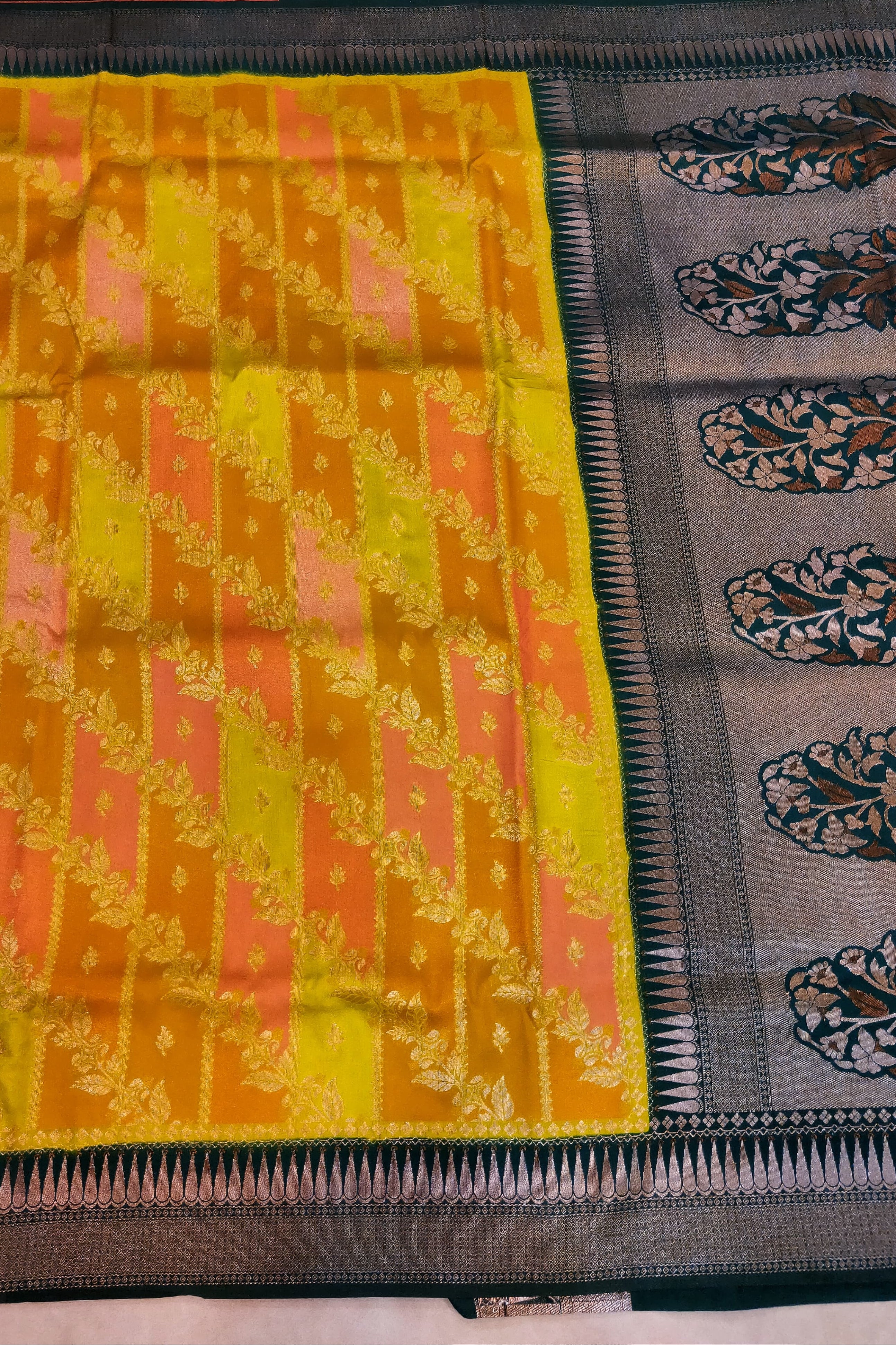 Saree with yellow and pink pattern on a gray background