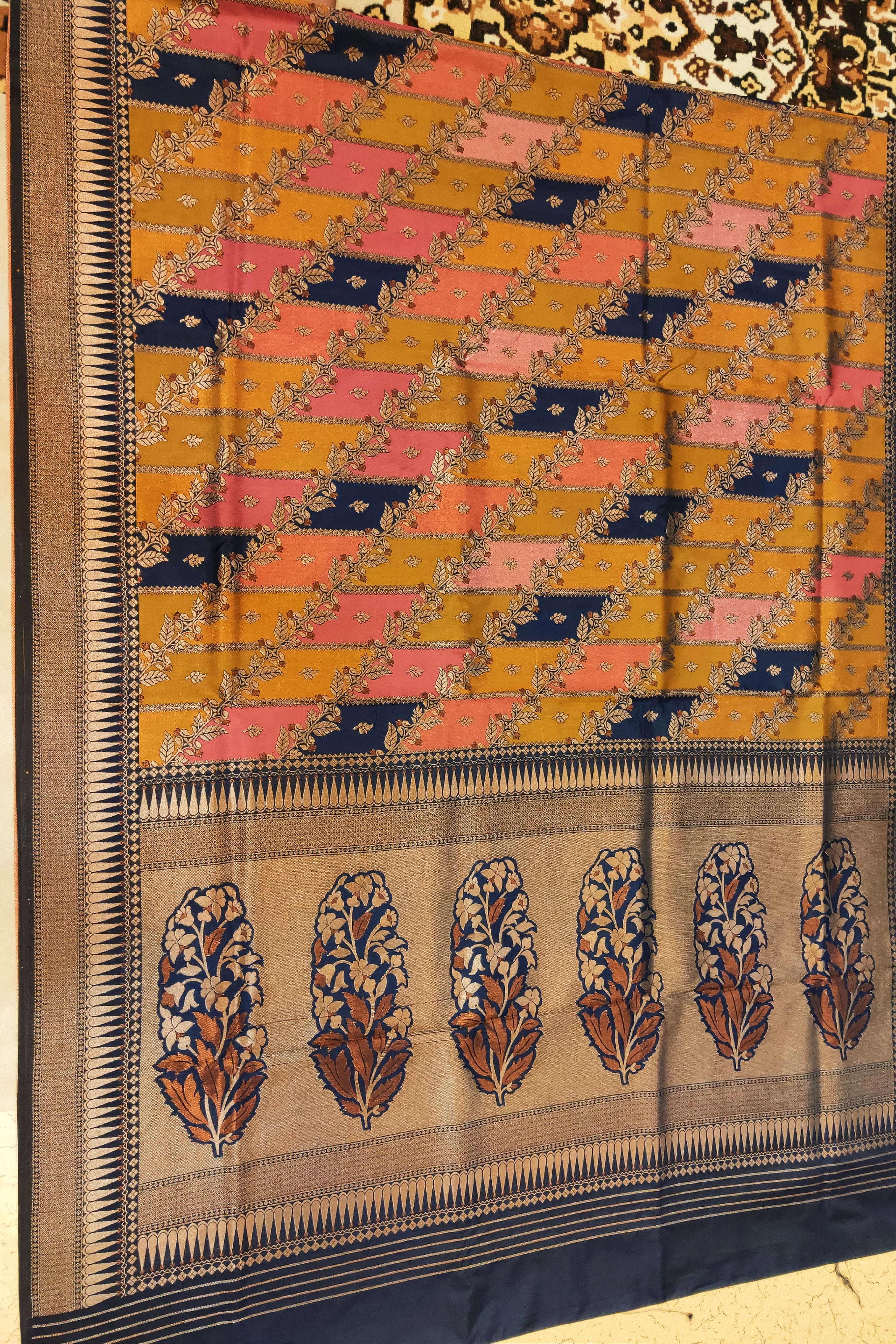 Traditional woven fabric with a geometric pattern on a plain background
