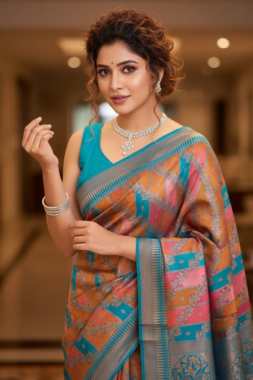 Woman wearing a colorful saree with a blurred indoor background