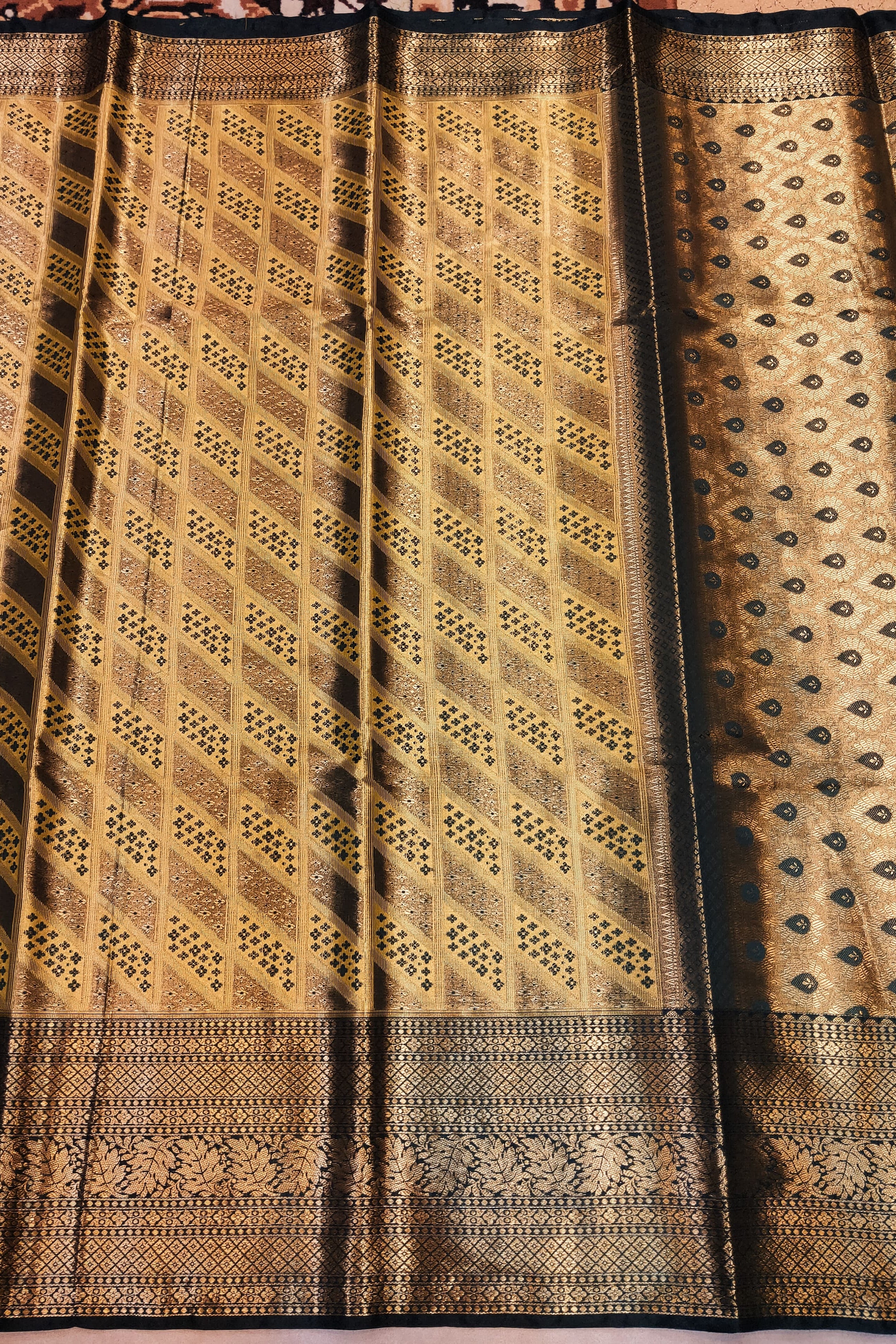 Traditional woven fabric with intricate patterns on a plain background