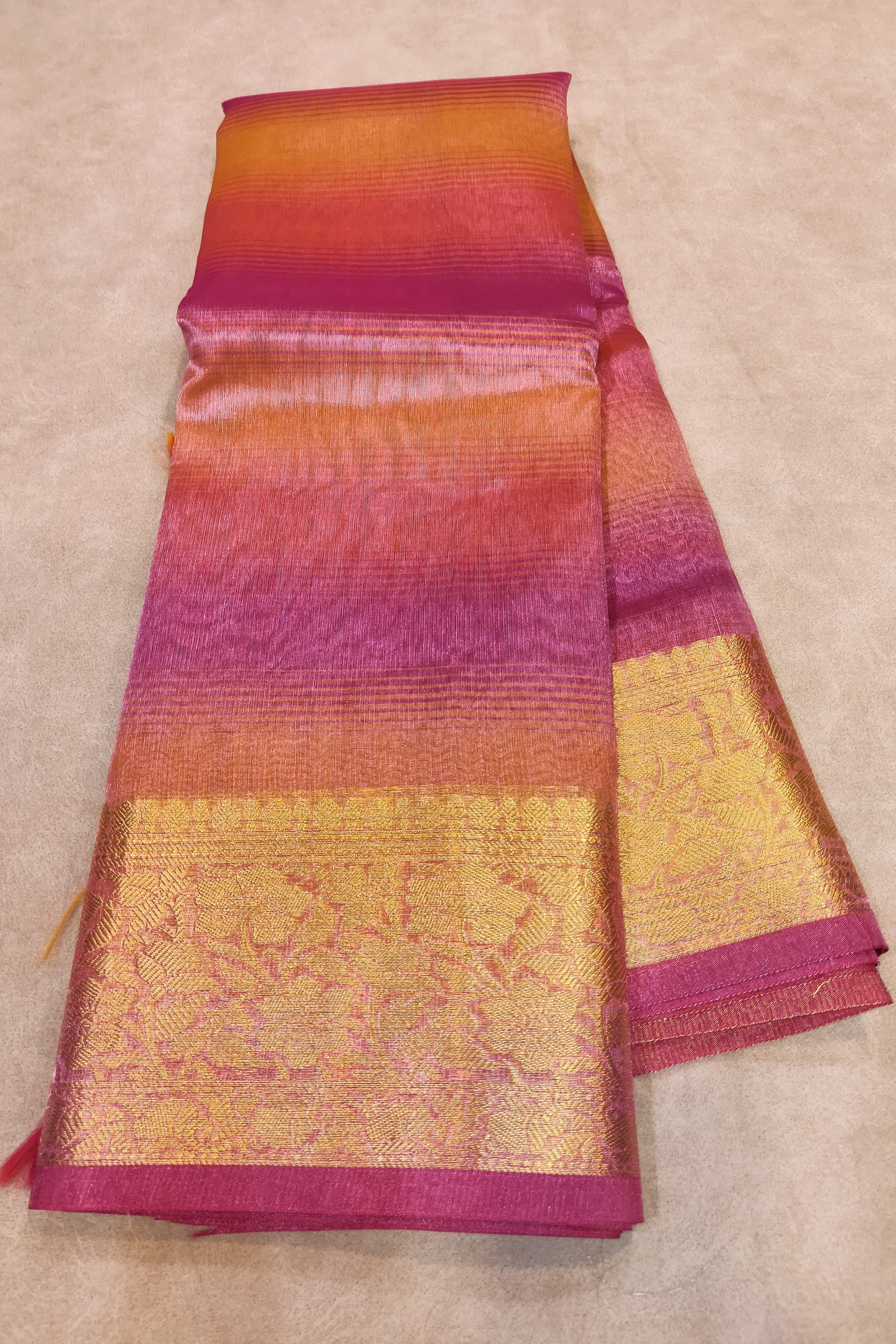 Colorful fabric with a gradient pattern on a beige background