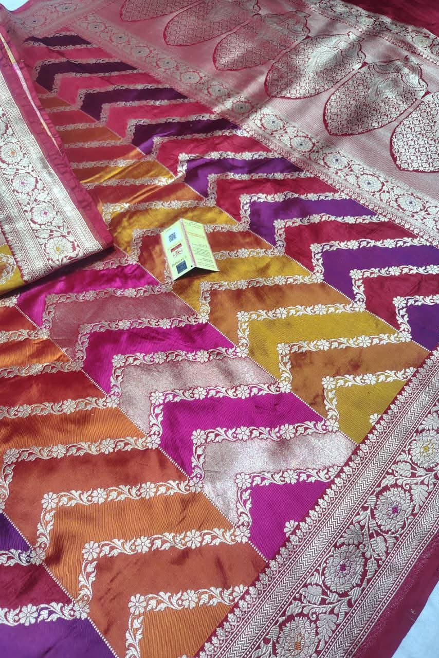 Colorful patterned fabric with zigzag design and intricate patterns.