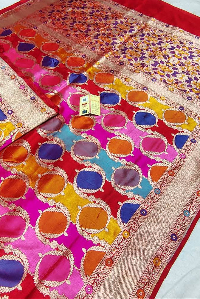 Colorful traditional fabric with intricate patterns on a white background