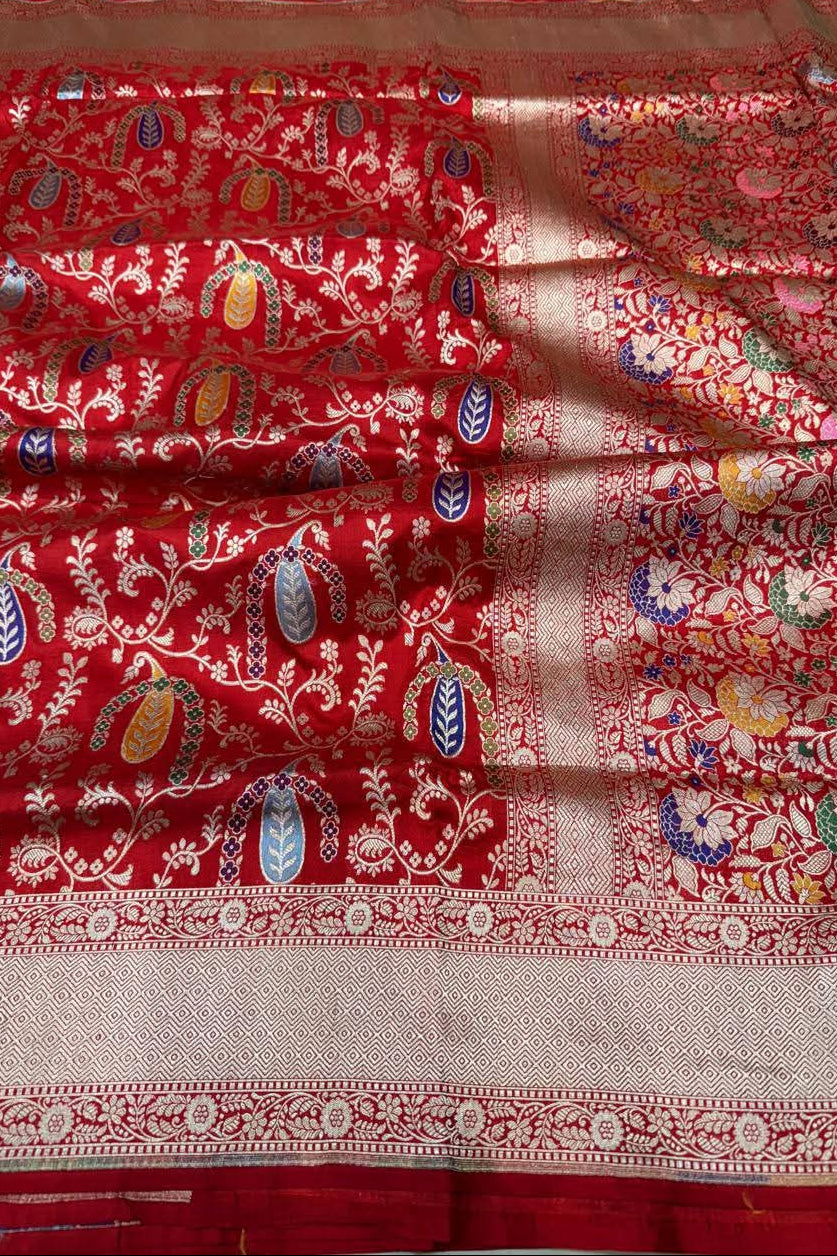Red fabric with intricate patterns and designs