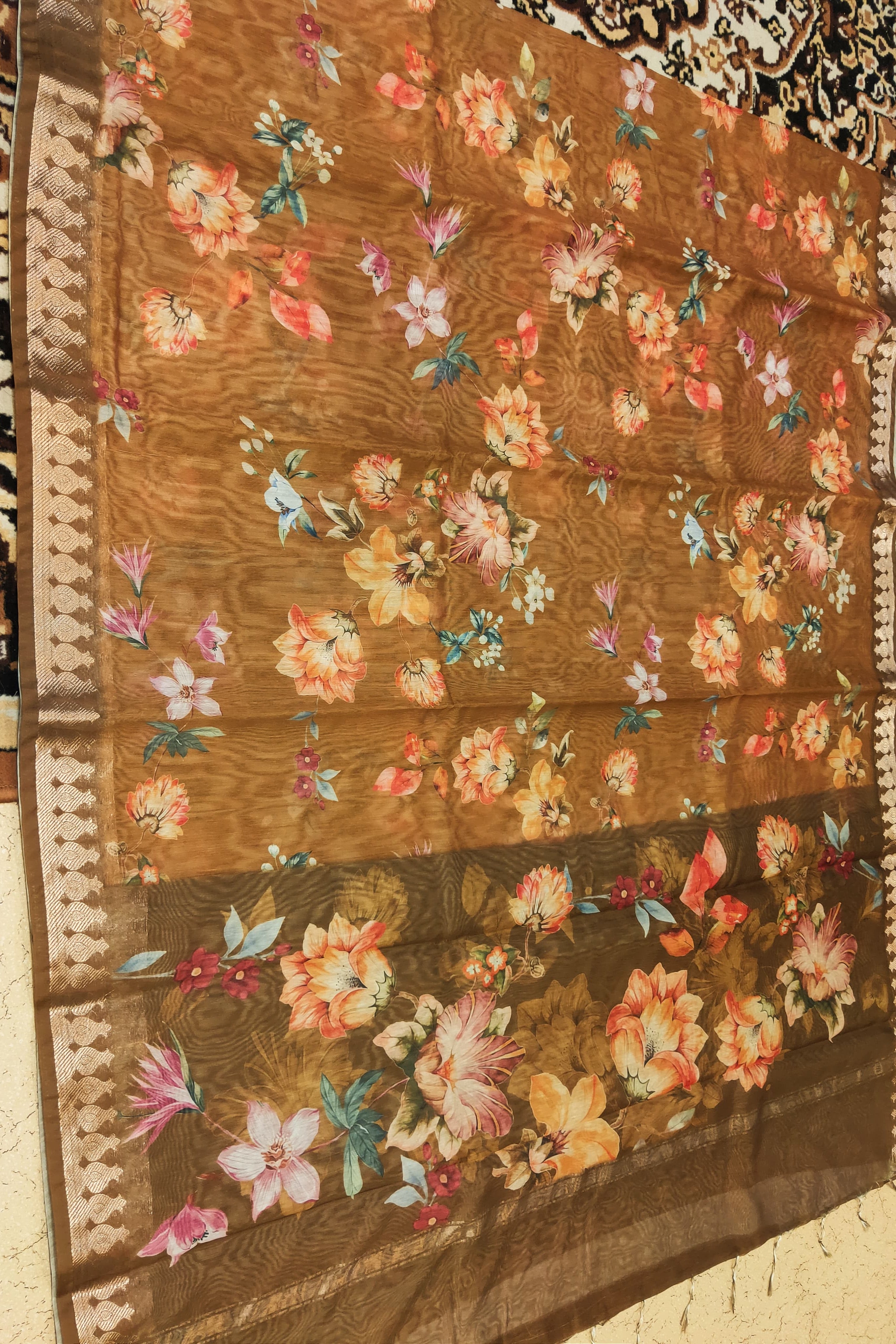 Floral patterned fabric on a brown background