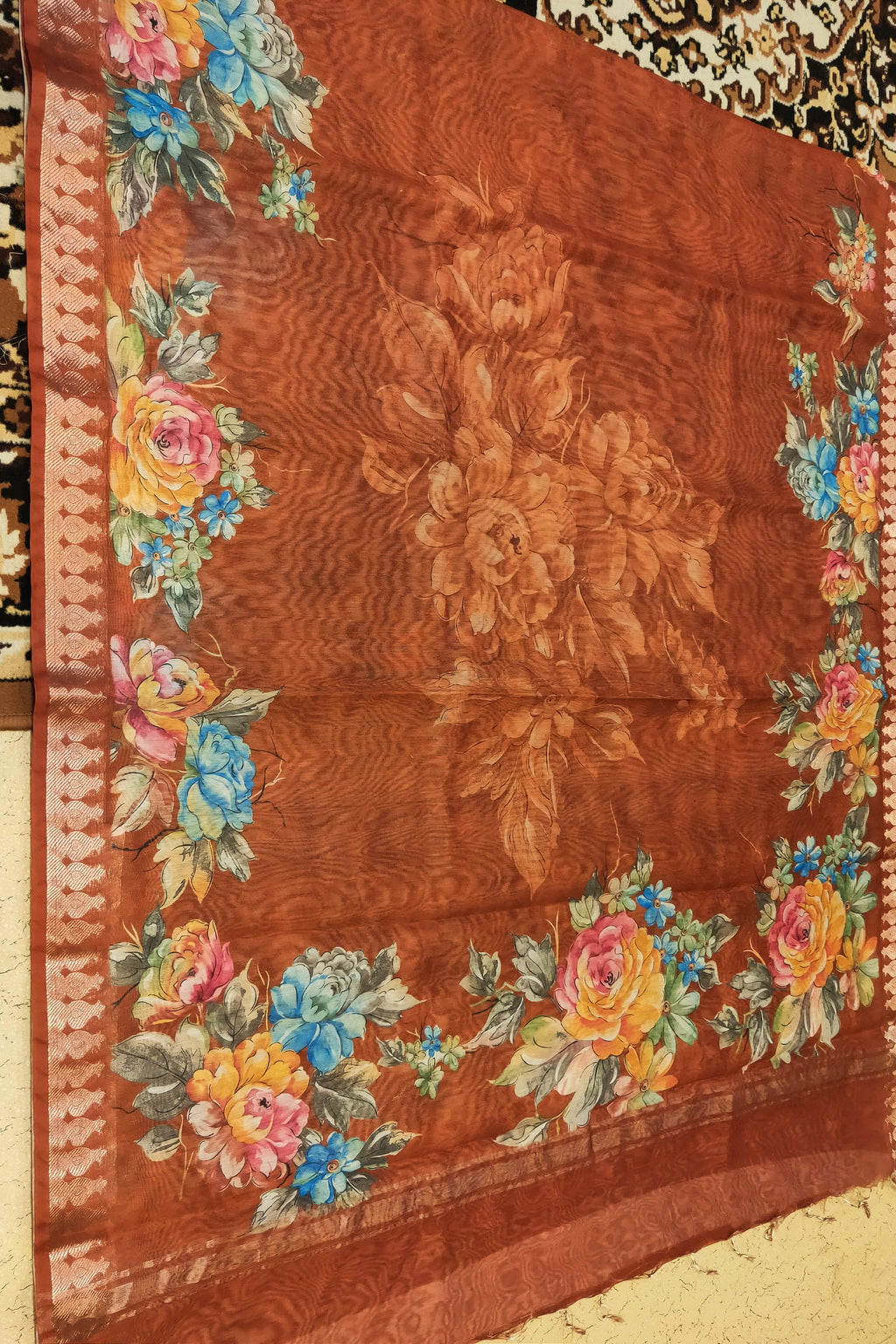 Floral-patterned fabric with a brown background