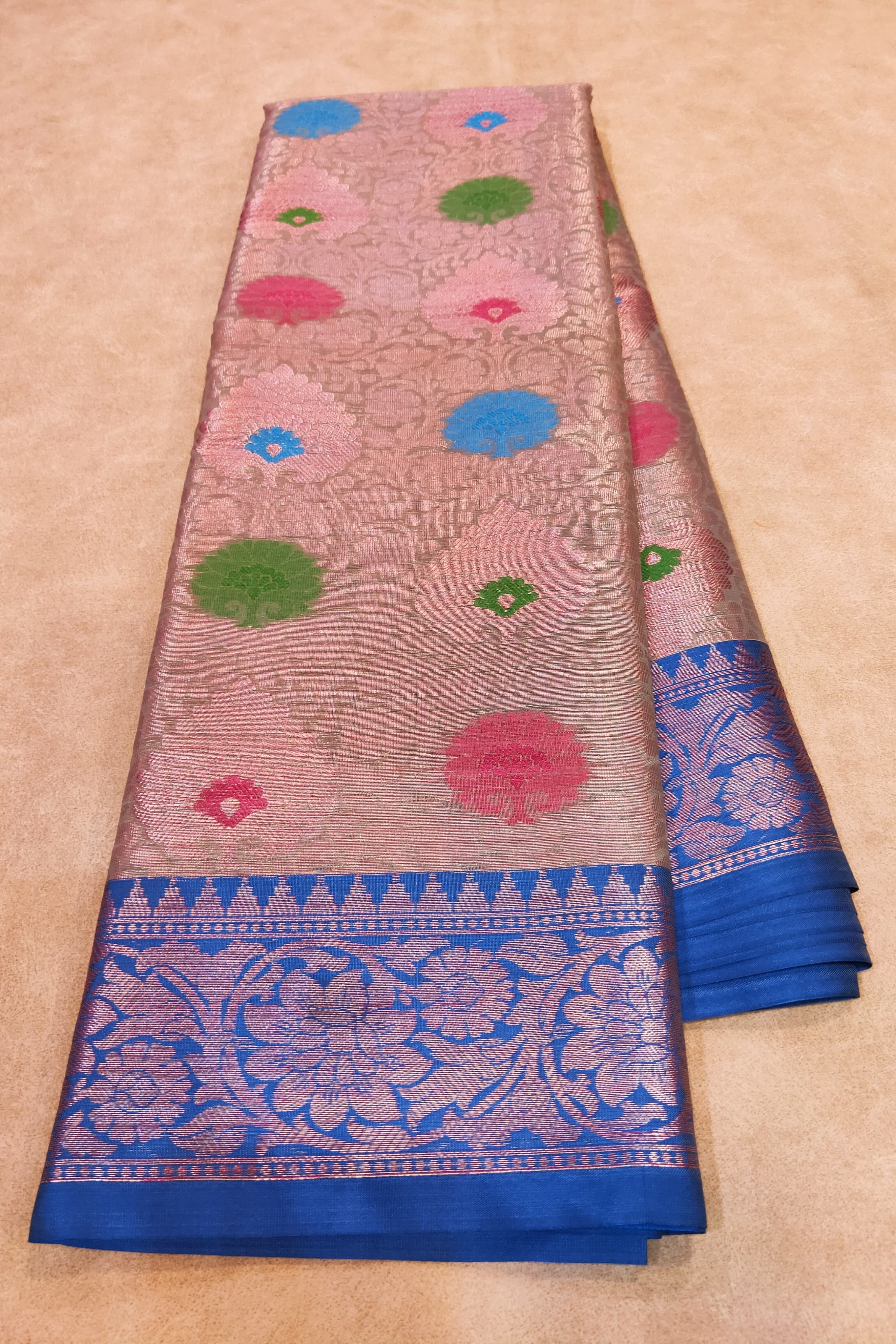 Saree with floral patterns on a beige background