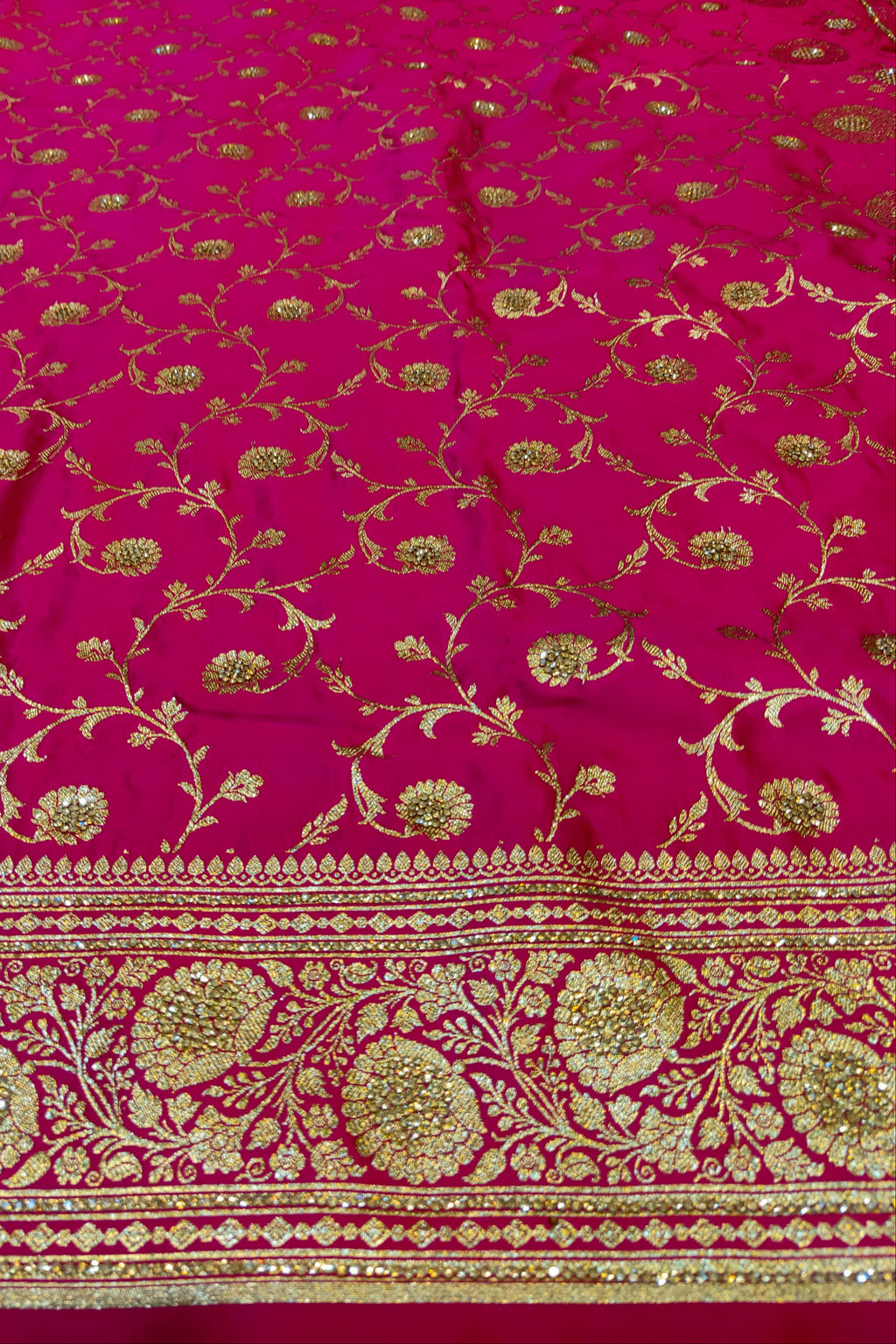 Pink fabric with gold floral patterns
