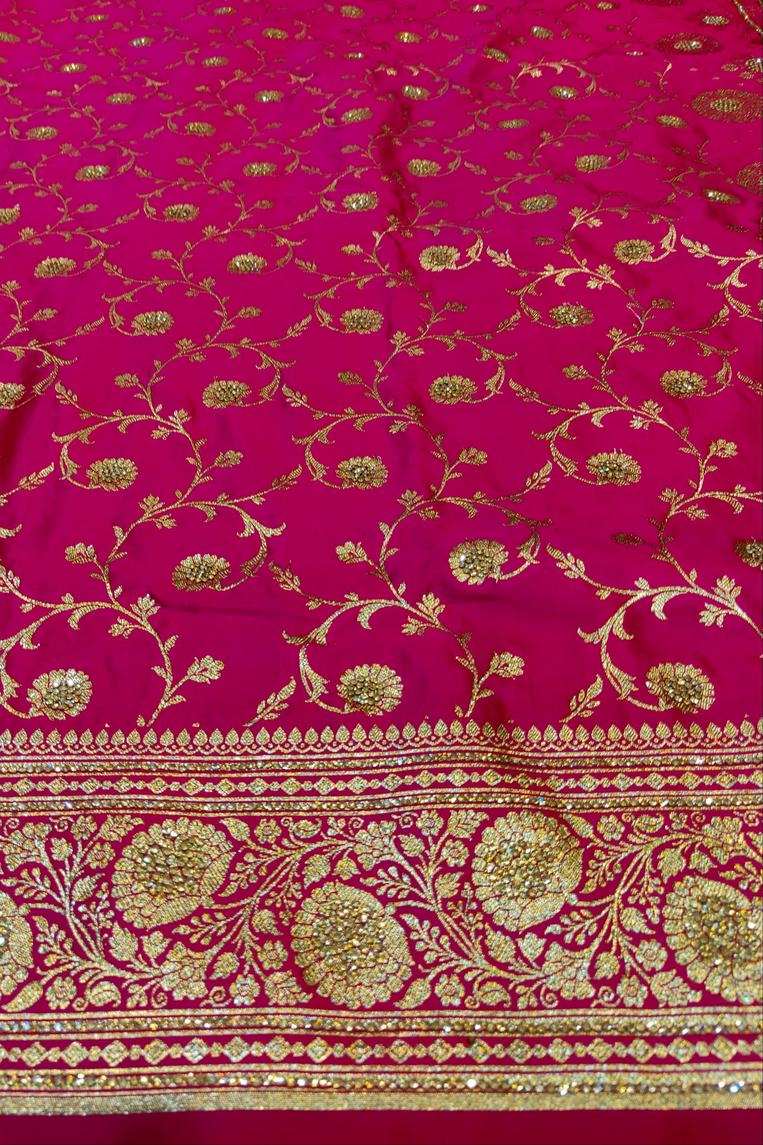 Pink fabric with gold floral patterns