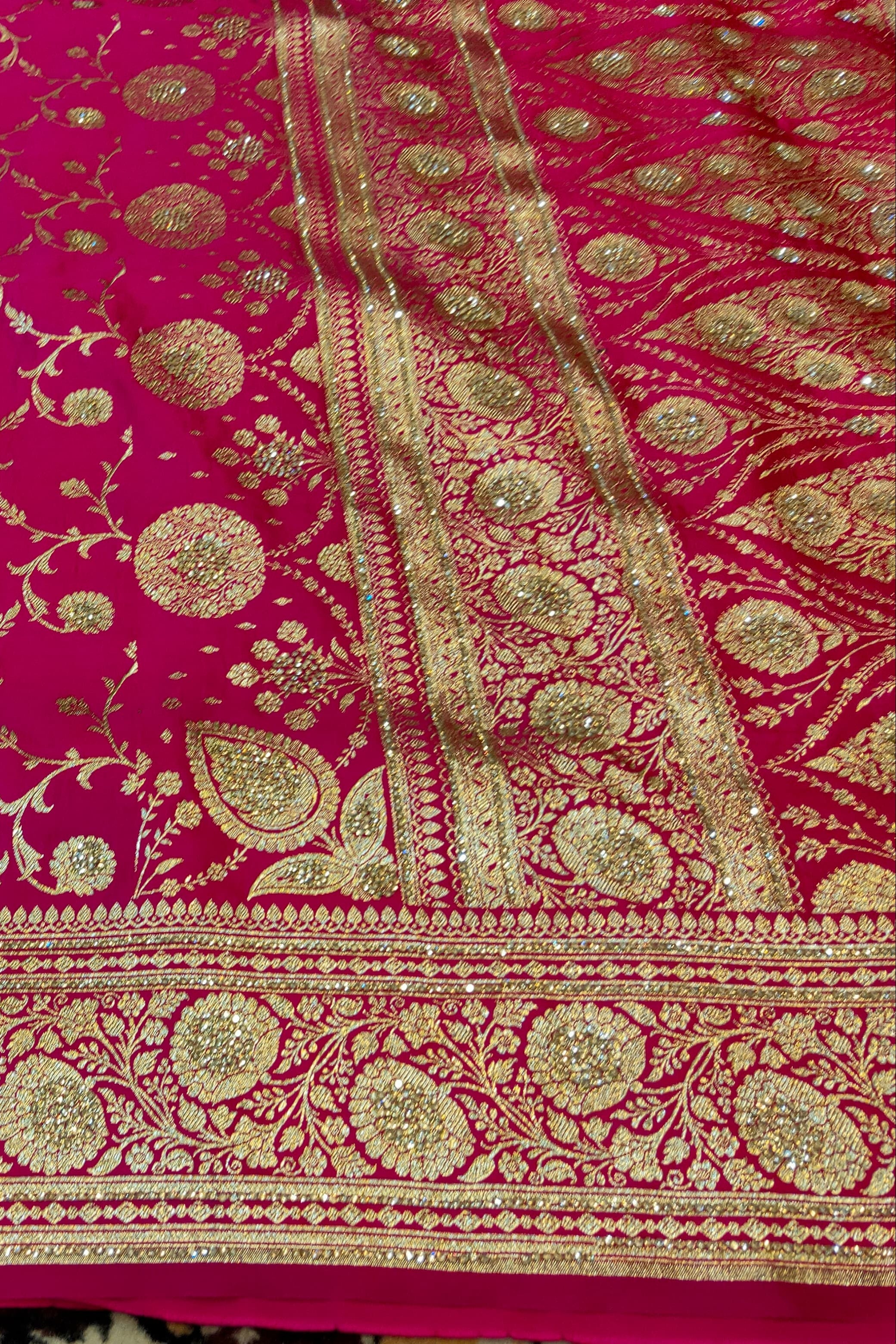 Pink fabric with gold intricate patterns