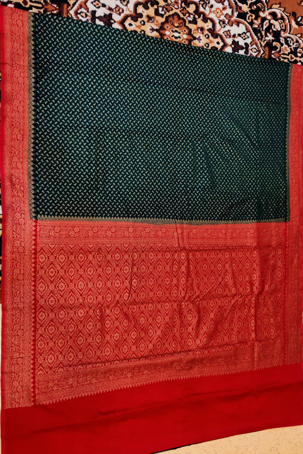 Black and red patterned fabric with a decorative border