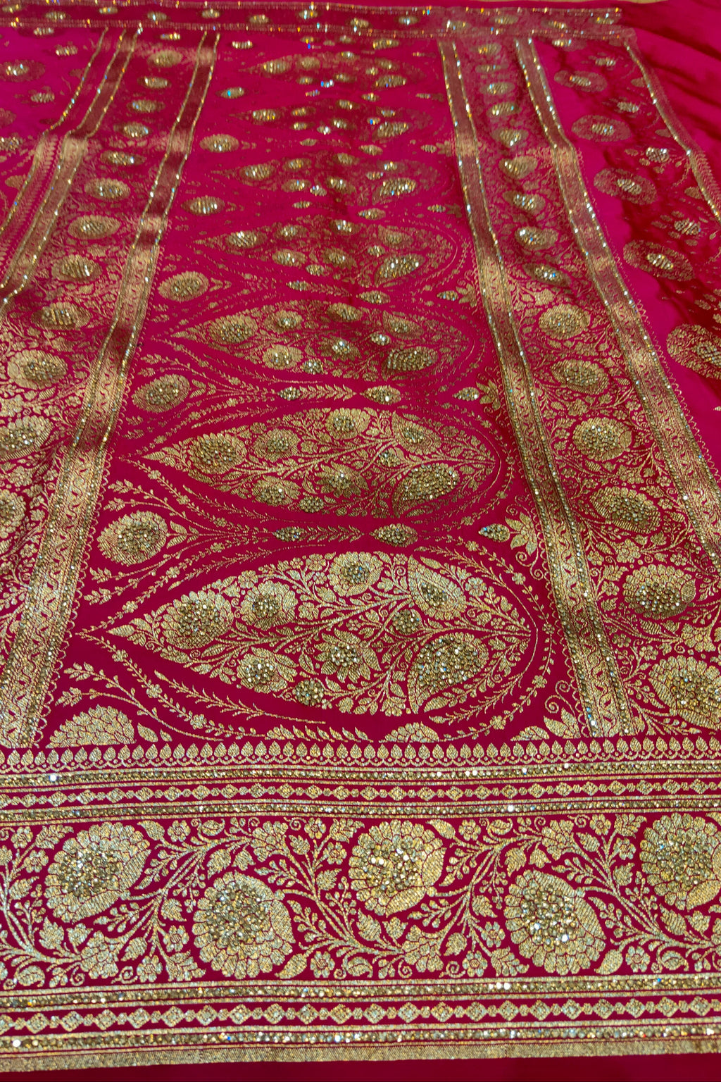 Pink fabric with intricate gold embroidery