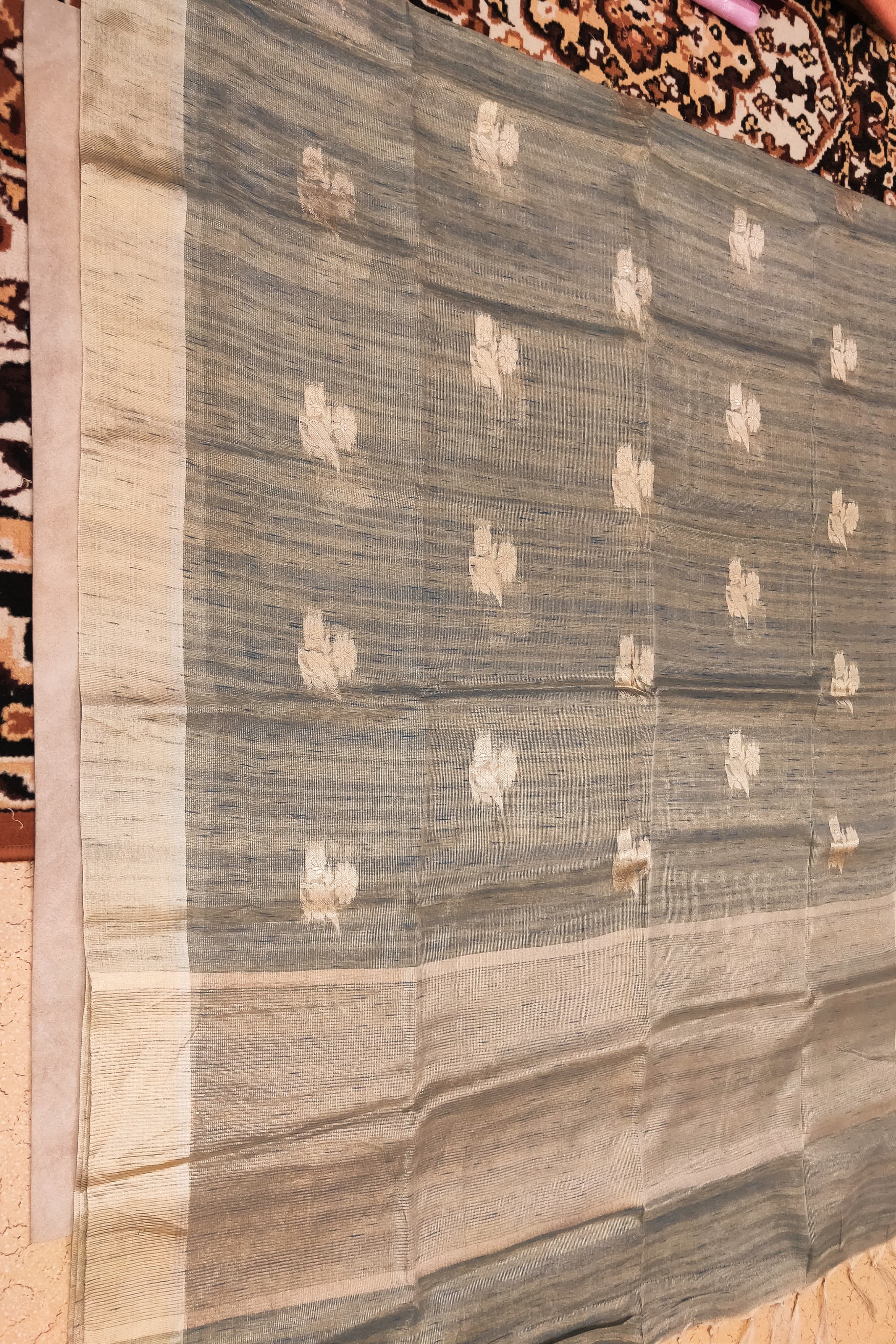 Textile with floral patterns on a plain background